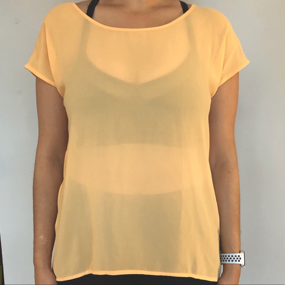 Sheer orange blouse with short sleeves